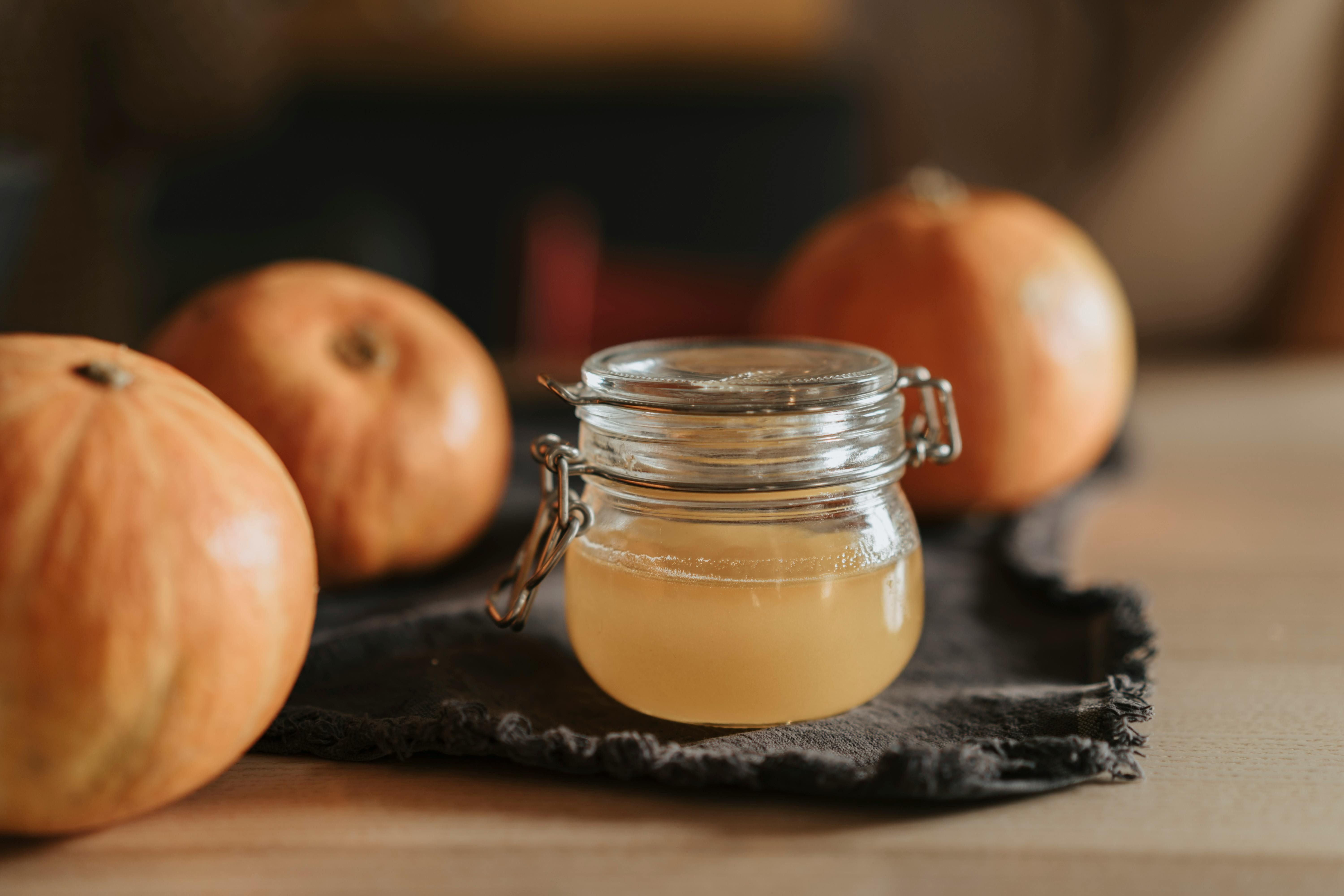 Apple Cider Vinegar in a Jar: A Powerful Fermented Beverage for Gut Health and Digestion A jar of apple cider vinegar, known for its gut health benefits and aiding digestion with prebiotics and acetic acid.