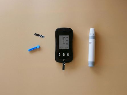 Understanding Hypoglycemia Risks with Intermittent Fasting: What You Need to Know A person checking their blood glucose level during an intermittent fast, concerned about hypoglycemia