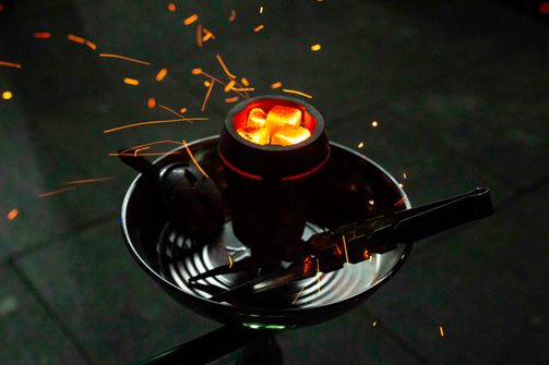 The Dangers of Using Hookahs for Women in 2024: Health Risks and Facts A woman experiencing the harmful effects of using hookahs, highlighting risks like respiratory issues, cancer, and infectious diseases.