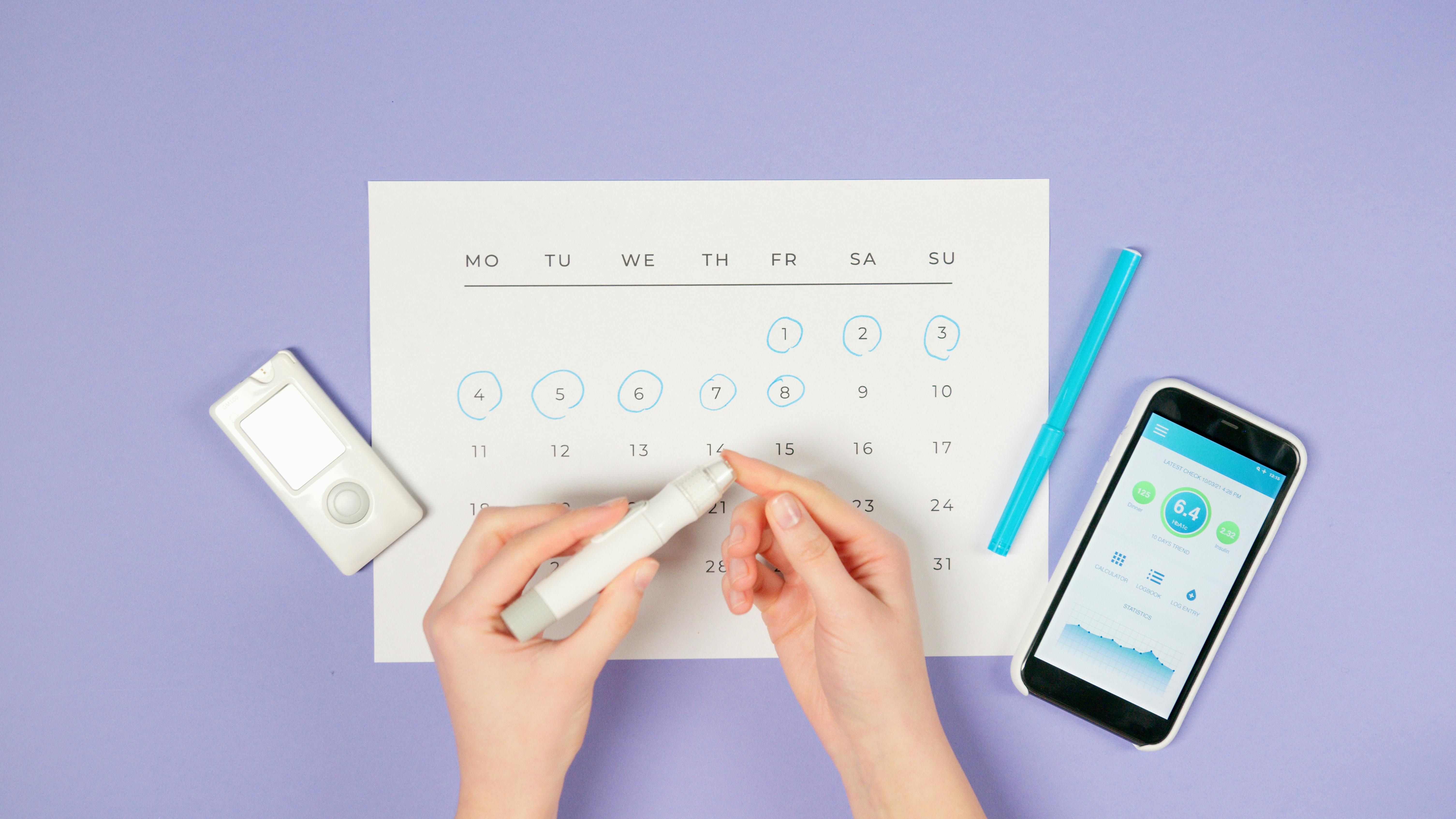 Managing Glucose for Intermittent Fasting with Type 1 Diabetes Woman with Type 1 Diabetes measuring glucose level before fasting