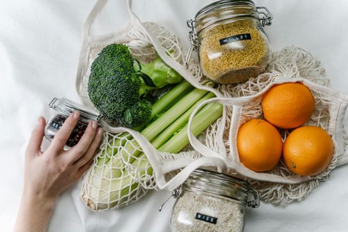 A woman is exploring healthy foods that contain vitamins for brain health and memory A woman is looking at healthy food that contain brain nutrients