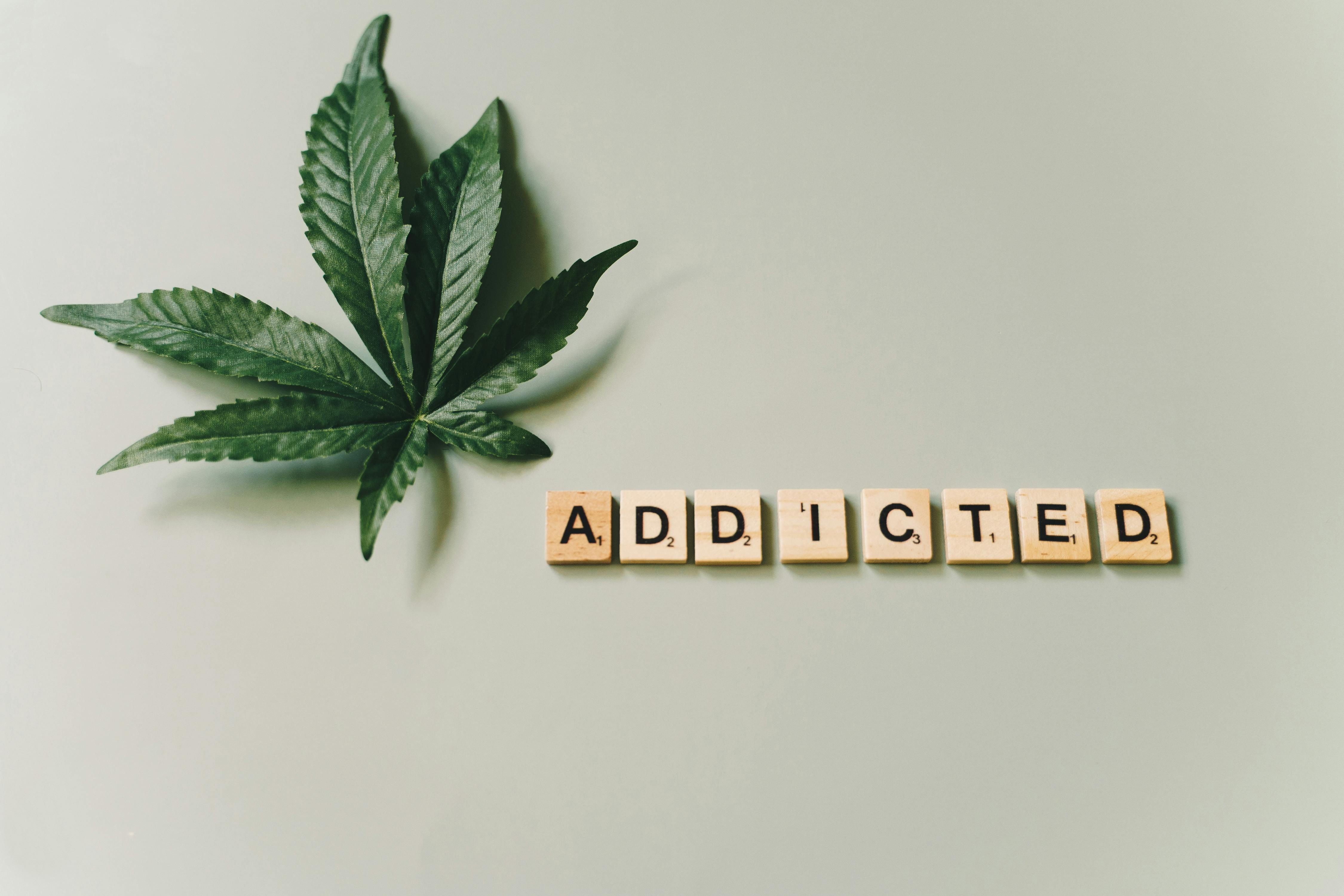 Understanding Weed Addiction: Signs, Symptoms, and Treatment Options Illustration highlighting the challenges of weed addiction, with symbols representing marijuana leaves and dependence.