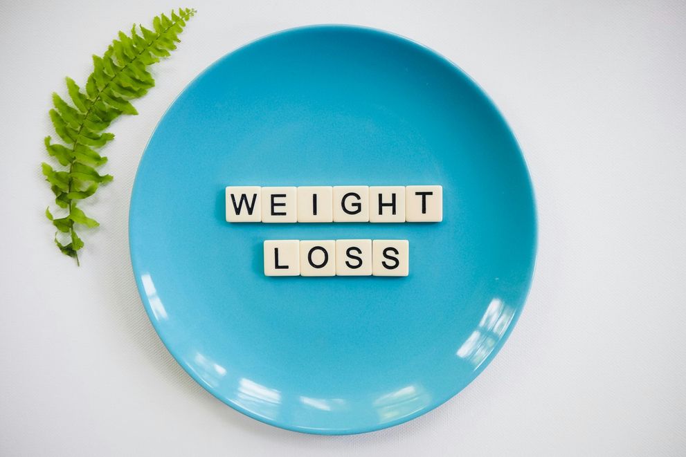 A blue plate with weight loss encouragement A plate with weight loss calling