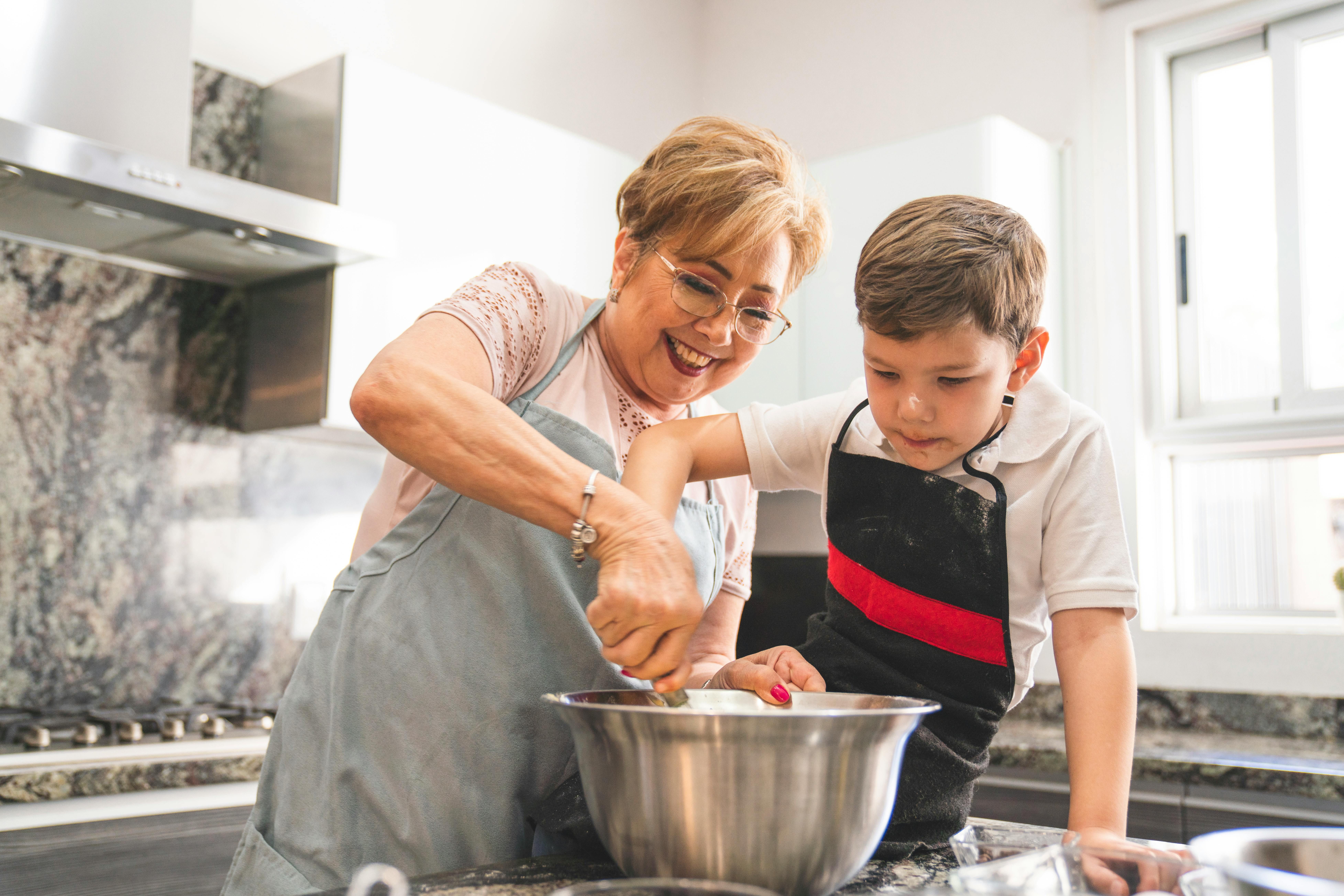 Family Bonds and Healthy Habits: Intermittent Fasting Brings Generations Together Grandmother and young grandson cooking together, bonding over a healthy meal during intermittent fasting eating window