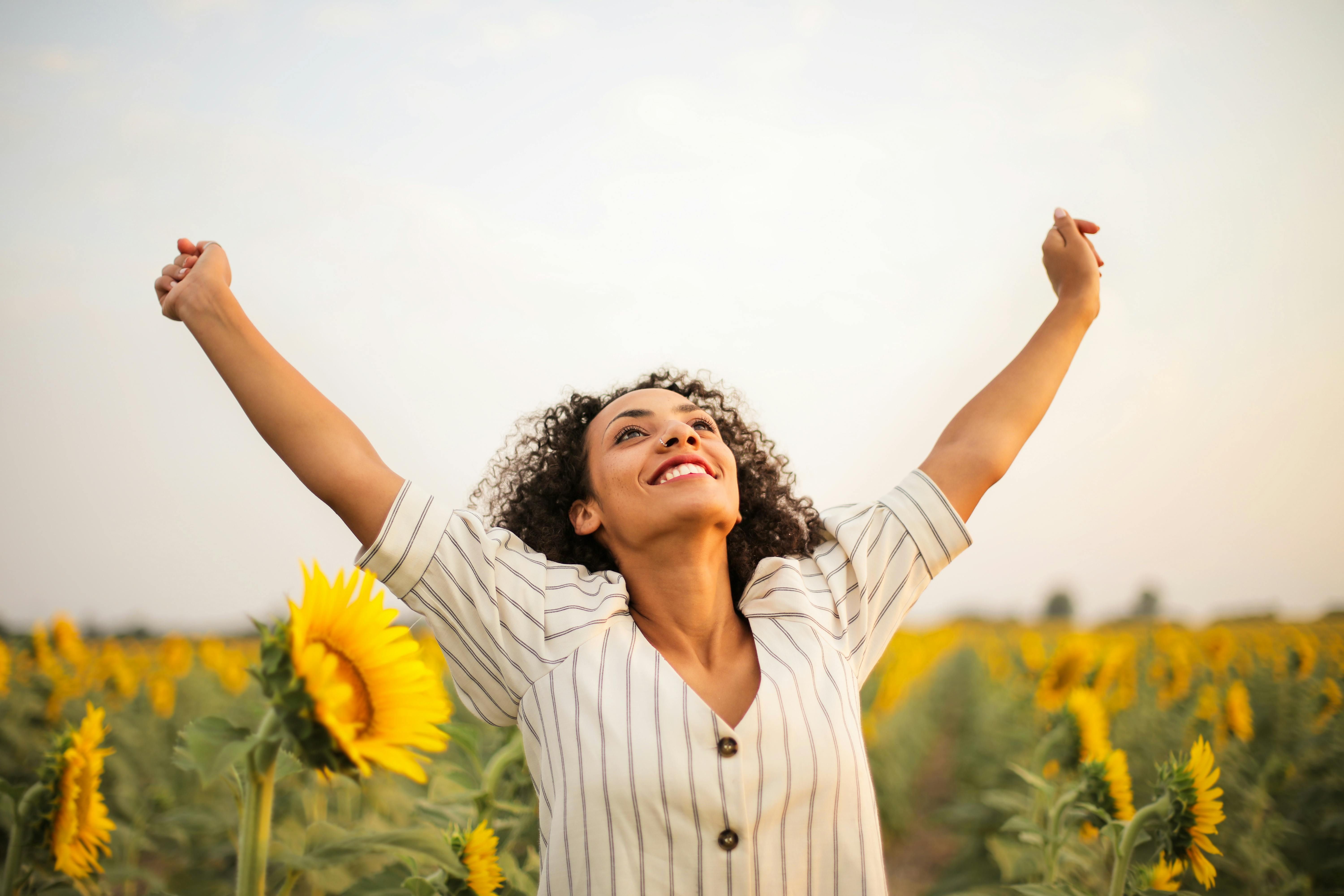 Woman Celebrating Relief from IBS Symptoms: A Journey to Wellness A joyful woman celebrating relief from IBS symptoms, smiling with a sense of freedom and comfort.