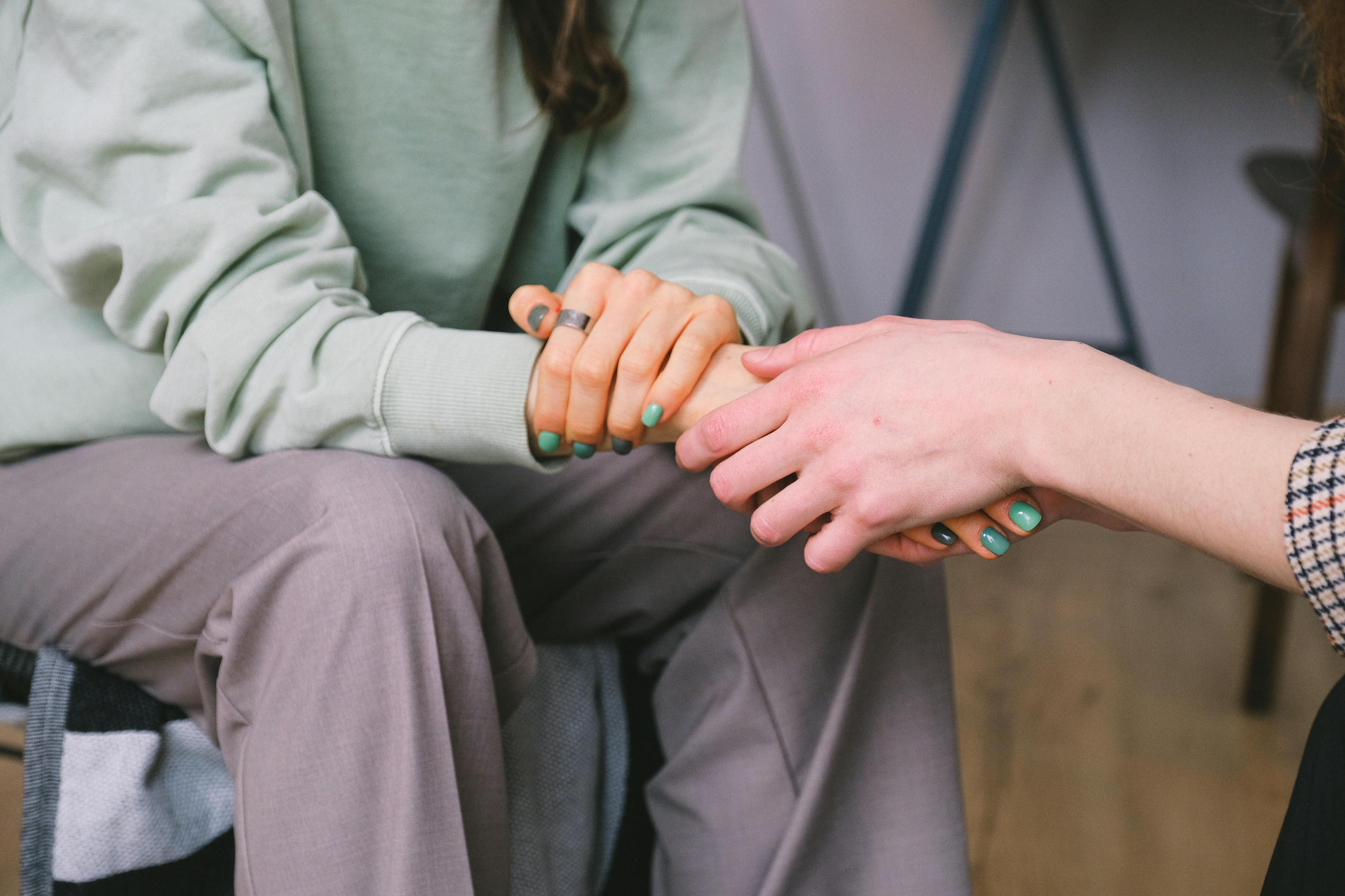 Together in Transformation: The Bond of Support in Women's Weight Loss Counseling Client and counselor holding hands, symbolizing support in weight loss counseling