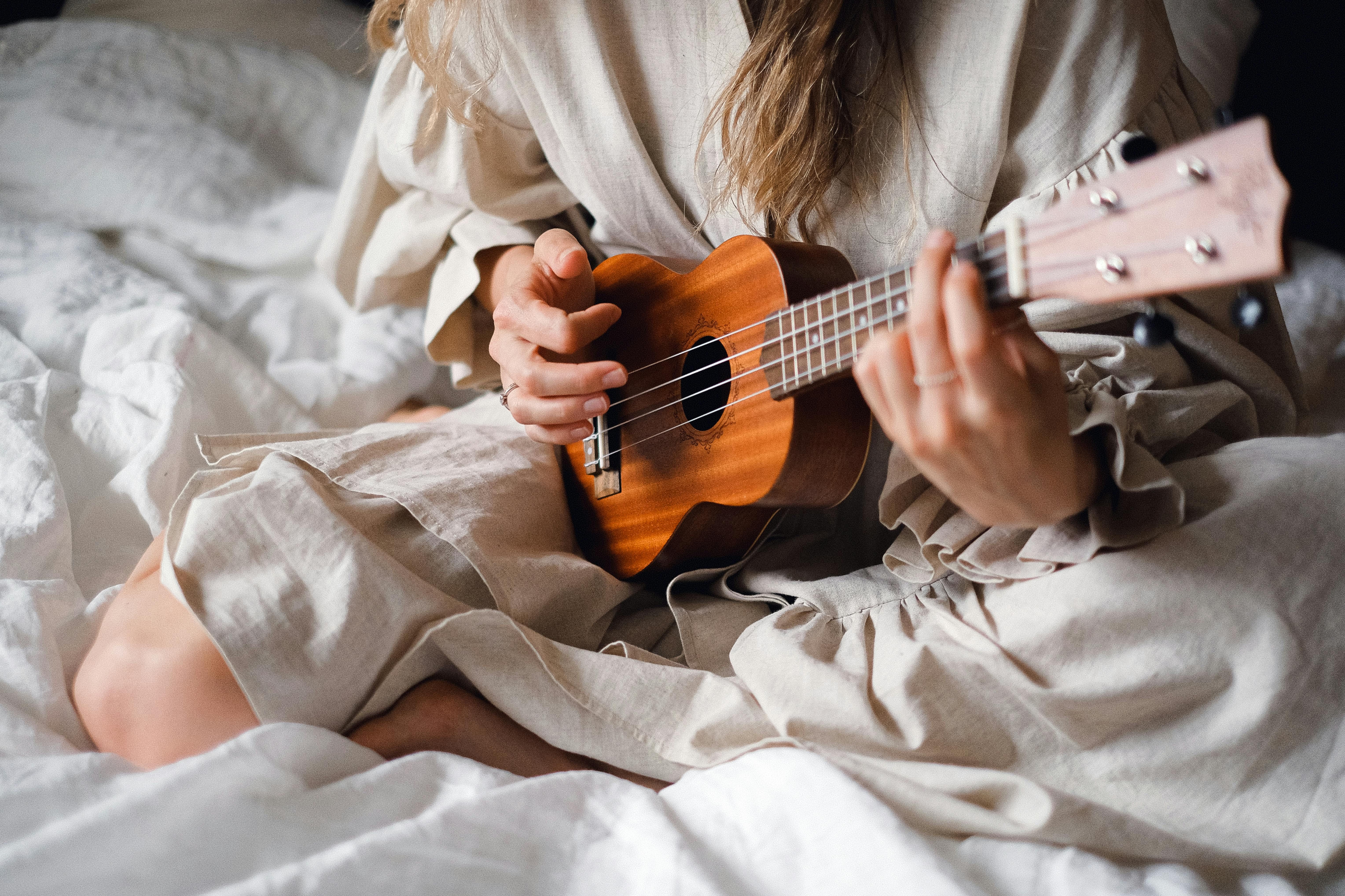 Woman Playing Ukulele: Boosting Longevity and Mental Wellness Through Music A woman playing the ukulele to enhance cognitive health and emotional well-being through creative expression.